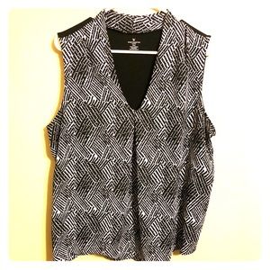 Black and white PXXL sleeveless blouse.